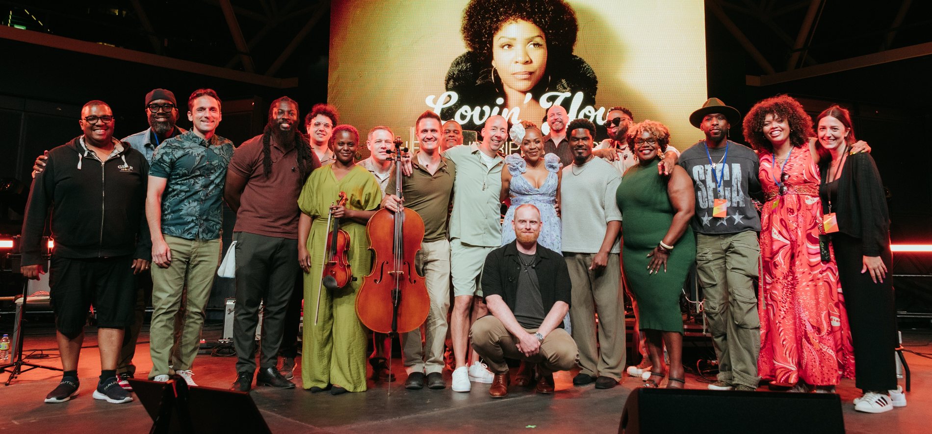 Divine Brown and the full cast and crew on stage after the show