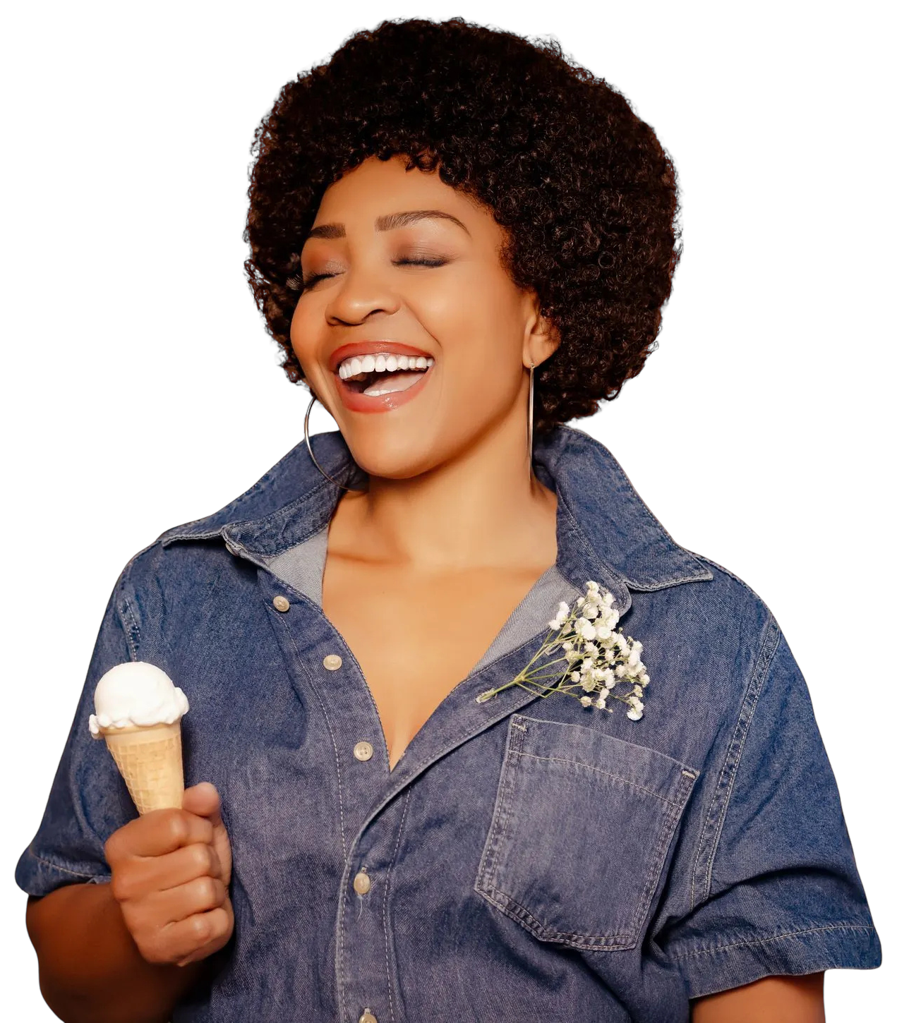 Divine Brown as Minnie Riperton, laughing in a denim jumpsuit holding an ice cream cone